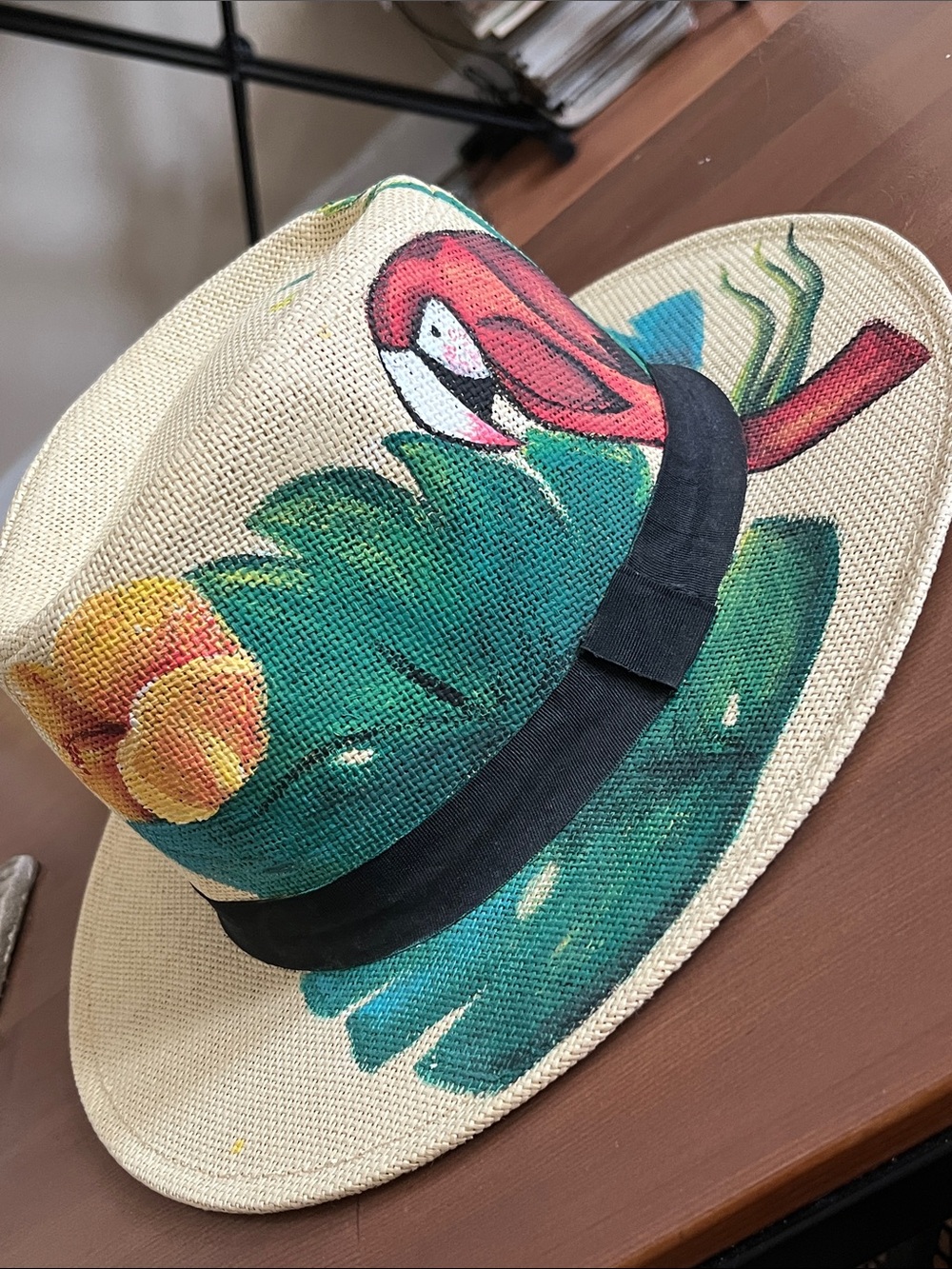 Hand-Painted Straw Sun Hat with Red Parrot and Green Tropical Leaves
